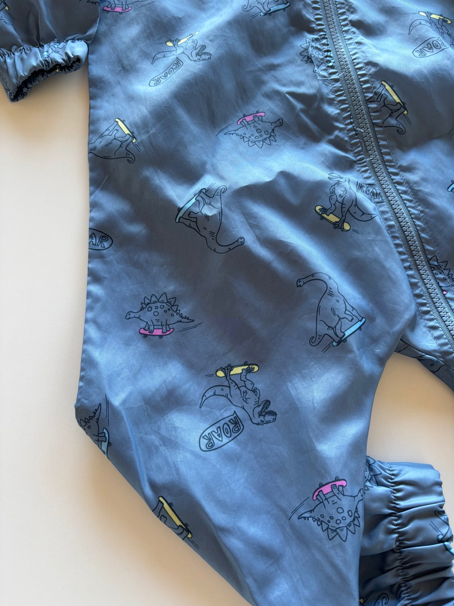 NWOT Blue Skateboarding Dinos Rain Suit