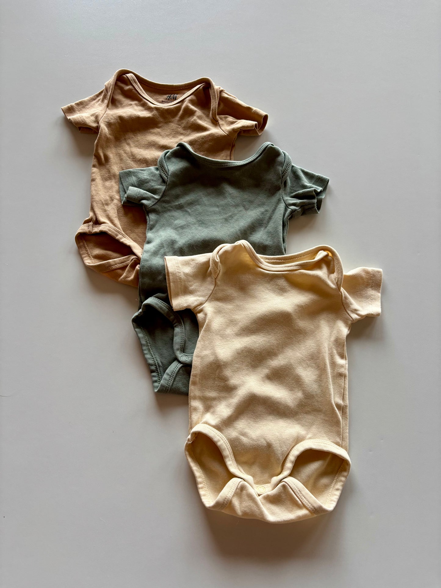 3 Onesies - yellow, green, brown