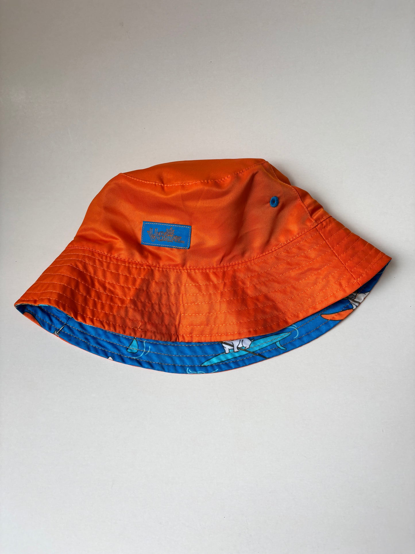 Reversible Orange & Paddle Dogs Bucket Hat