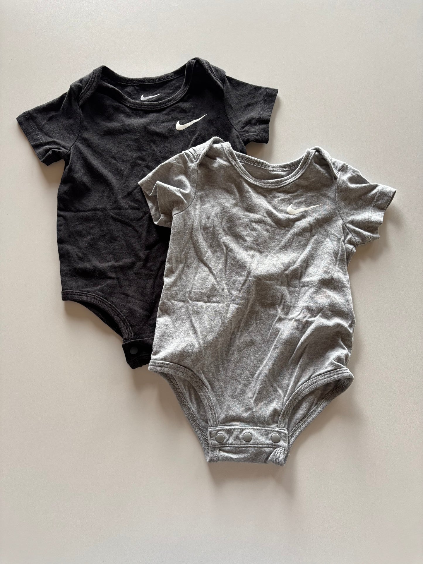 2 Neutral Nike Onesies
